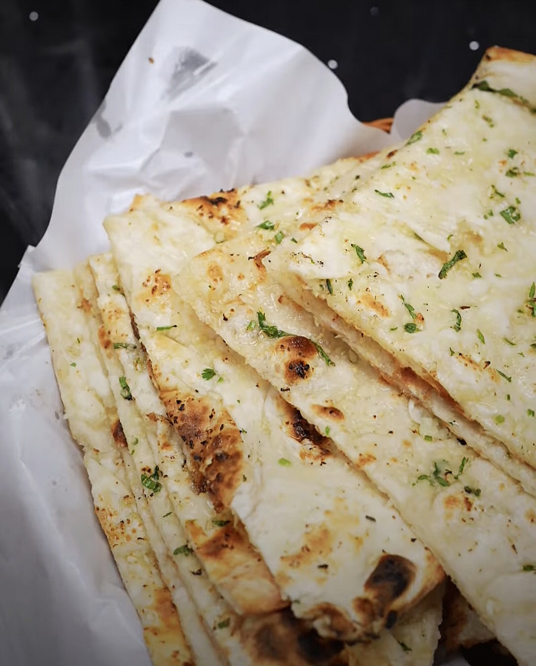 Fresh-off-the-tandoor garlic naan